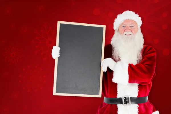 Papai Noel mostrando quadro negro — Fotografia de Stock