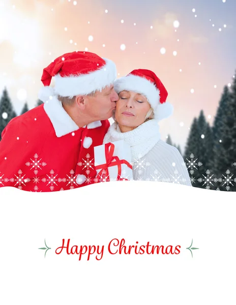 Image composite de couple mature festif tenant cadeau — Photo