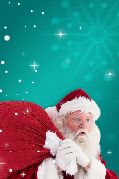 Santa takes care about sack — Stock Photo, Image