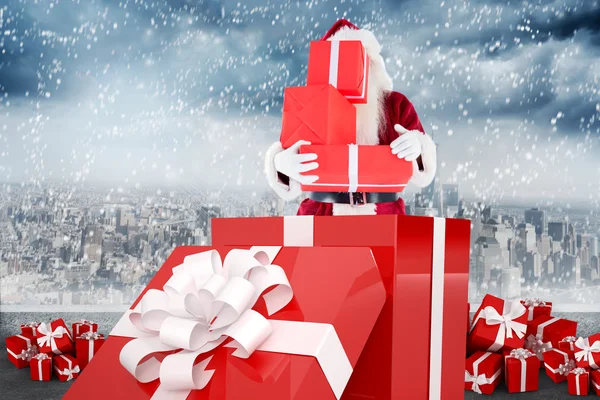 Santa standing in large gift — Stock Photo, Image