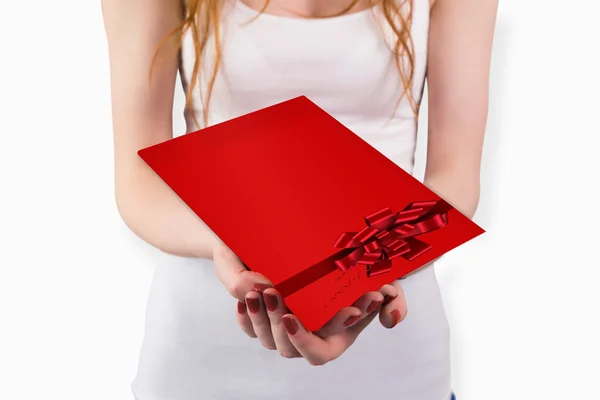 Woman holding red and white gift — Stock Photo, Image