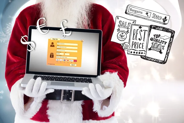 Santa Claus presenterar en laptop — Stockfoto