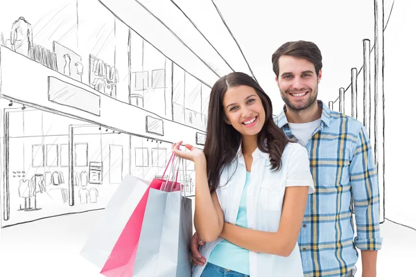 Casal feliz com sacos de compras — Fotografia de Stock