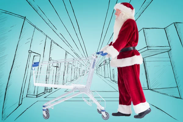 Weihnachtsmann schiebt einen Einkaufswagen — Stockfoto