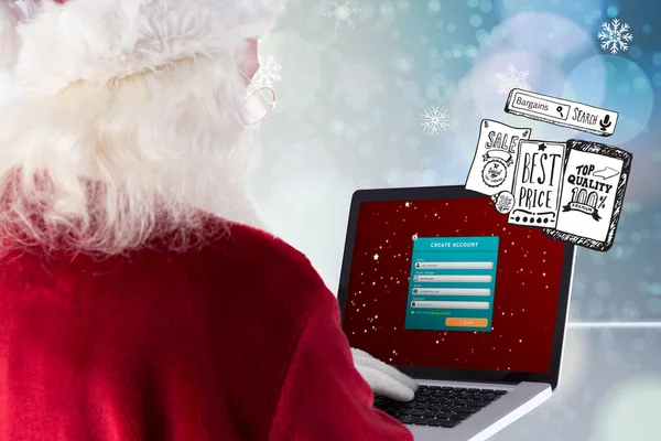 Babbo Natale utilizza un computer portatile — Foto Stock