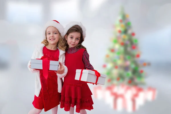 Samengestelde afbeelding van leuke meisjes met geschenken — Stockfoto