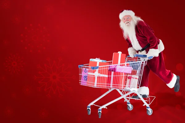 Weihnachtsmann fährt auf einem Einkaufswagen — Stockfoto