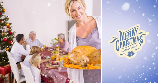 Proud mother showing roast turkey — Stock Photo, Image