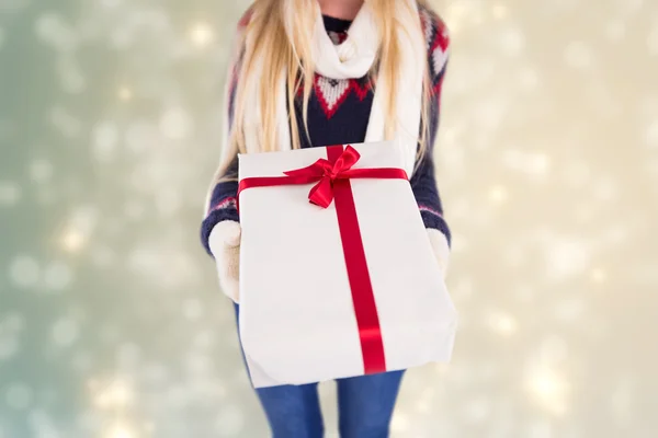 Festive blonde holding a gift — Stock Photo, Image