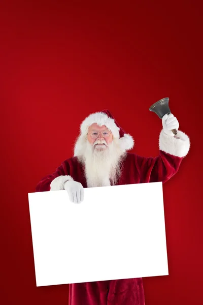 Santa innehar tecken och bell — Stockfoto