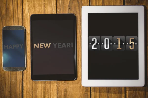 2015 mot tablett och smartphone — Stockfoto