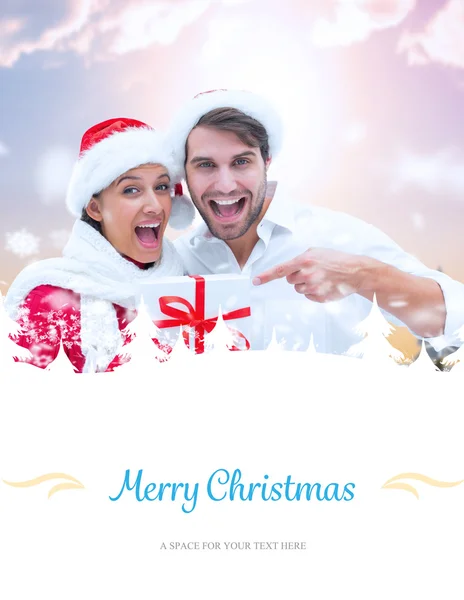 Image composite de jeune couple festif tenant un cadeau — Photo