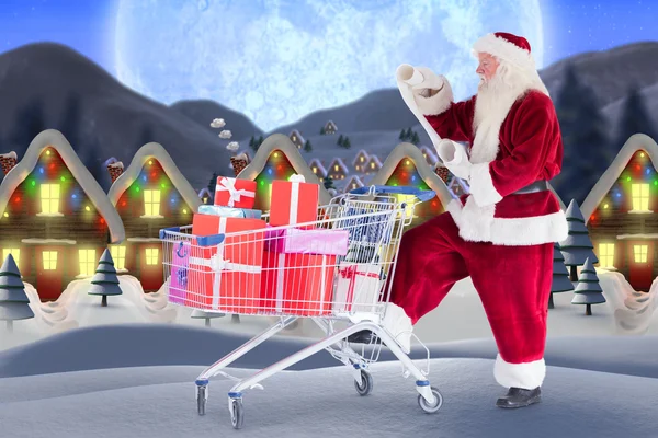 Weihnachtsmann bringt Geschenke aus dem Einkaufswagen — Stockfoto