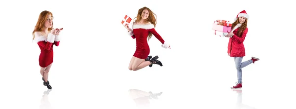 Festive redhead blowing over hands — Stock Photo, Image