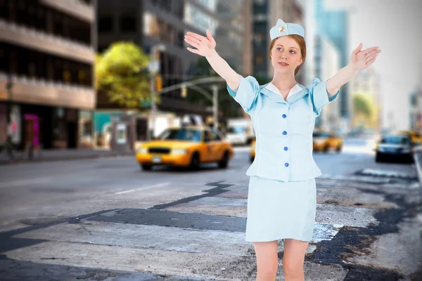 Pretty air hostess with arms raised — Stock Photo, Image