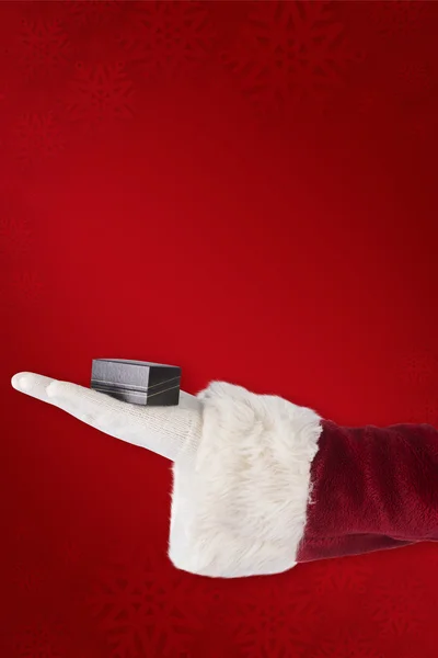 Santas hand shows small box — Stock Photo, Image