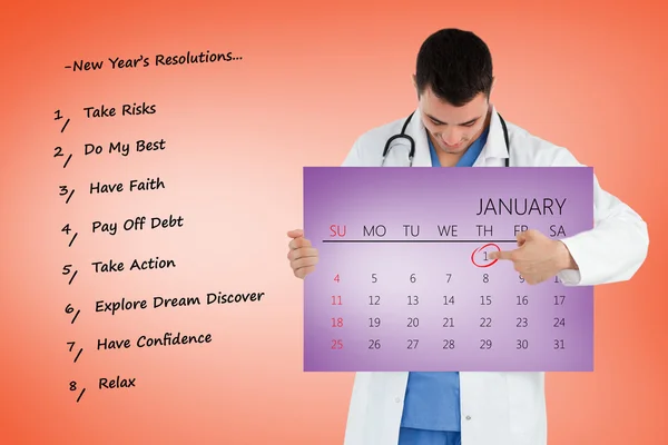 Retrato de un joven médico señalando un calendario — Foto de Stock