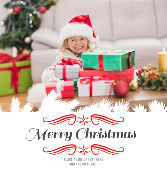 Girl surrounded by christmas gifts — Stock Photo, Image