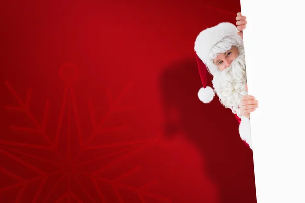 Babbo Natale sorridente che presenta segno — Foto Stock