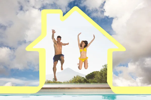 Cheerful couple jumping into swimming pool — Stock Photo, Image