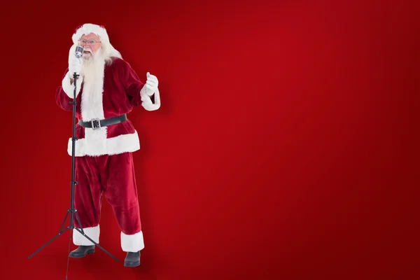 Weihnachtsmann singt wie ein Superstar — Stockfoto