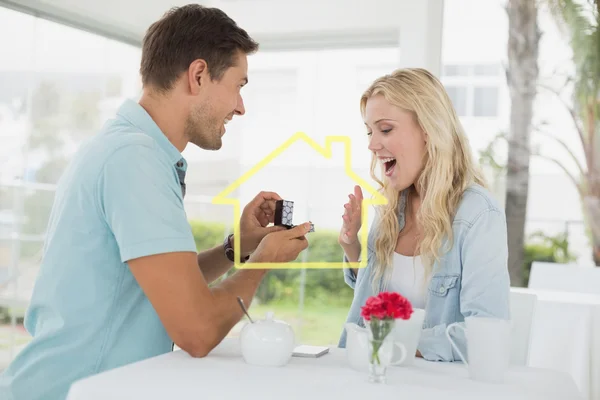 Man proposing marriage to his shocked blonde — Stock Photo, Image