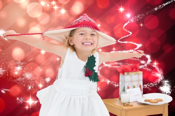 Samengestelde afbeelding van schattig meisje met Kerstmis — Stockfoto