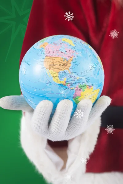 Santa has globe in hand — Stock Photo, Image