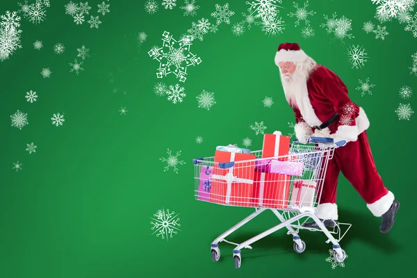 Santa rides on shopping cart — Stock Photo, Image