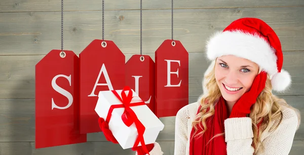 Happy festive blonde with gift — Stock Photo, Image