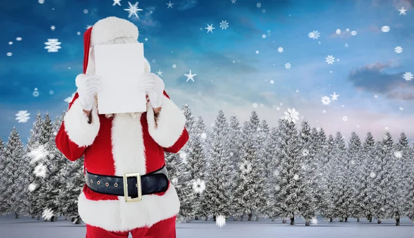 Weihnachtsmann präsentiert Karte — Stockfoto