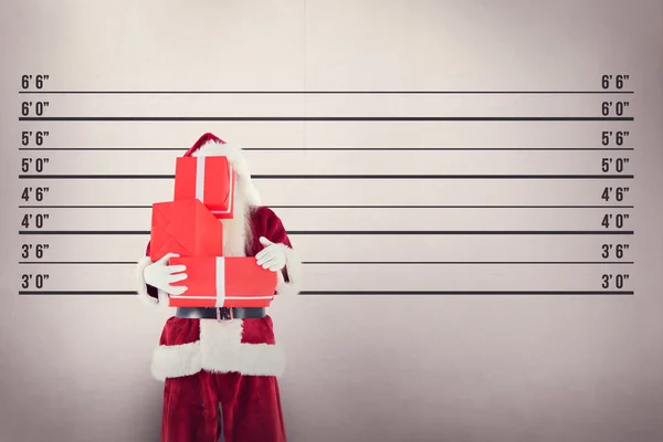 Santa covers his face with presents — Stock Photo, Image