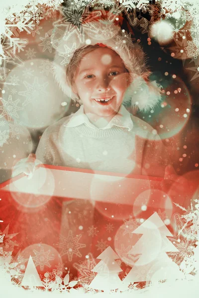 Child opening his christmas present — Zdjęcie stockowe