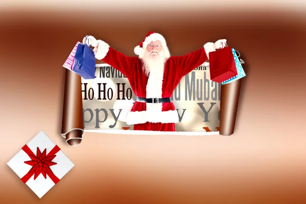 Santa holds some bags for Chistmas — Stock Photo, Image