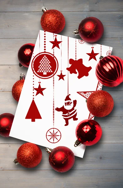 Composite image of hanging red christmas decorations — Stock Photo, Image