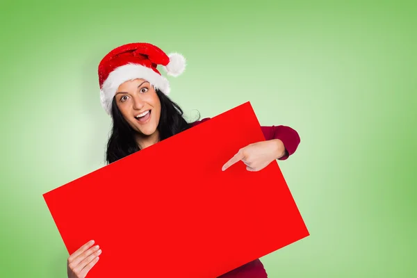 Woman pointing at sign — Stock Photo, Image