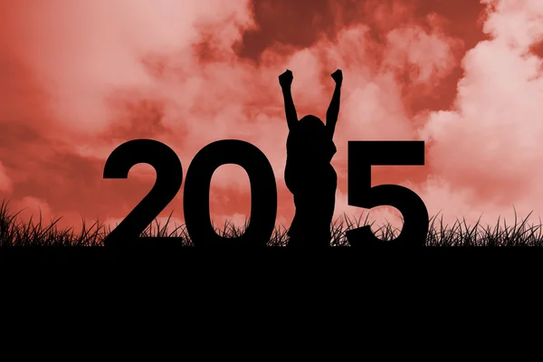 Cheering female against red sky — Stock Photo, Image