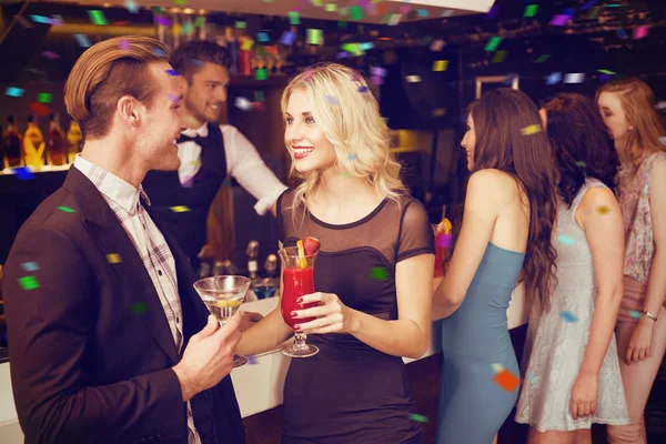 Attractive friends drinking cocktails — Stock Photo, Image