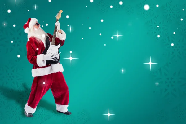 Santa playing electric guitar — Stock Photo, Image