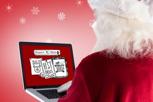 Santa claus uses a laptop — Stock Photo, Image