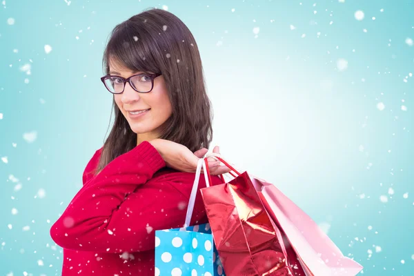 Morena sosteniendo bolsas de compras — Foto de Stock