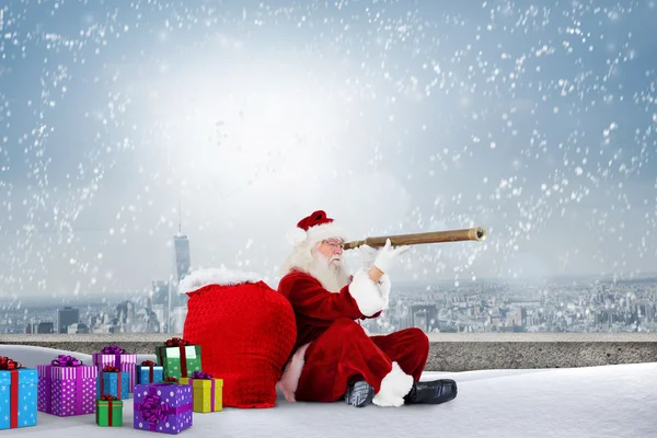 Santa looking through telescop — Stock Photo, Image