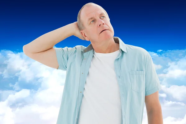 Thoughtful older man looking up — Stock Photo, Image