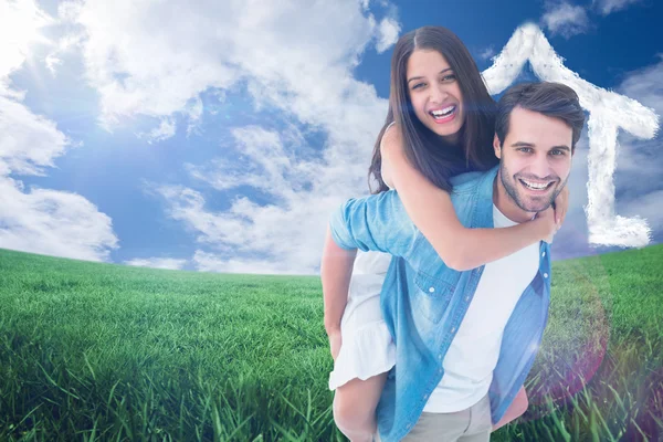 Hipster giving his girlfriend piggy back — Stock Photo, Image