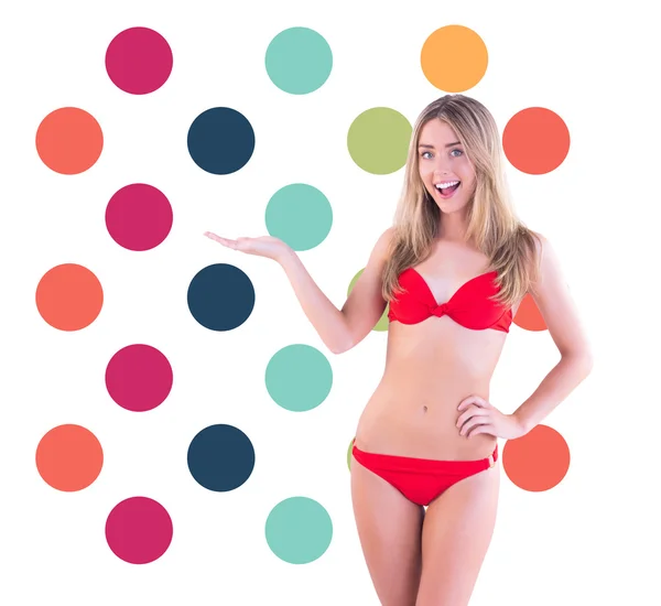 Blonde in red bikini showing scales — Stock Photo, Image