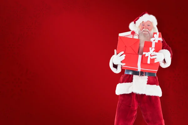 Santa bär några presenter — Stockfoto