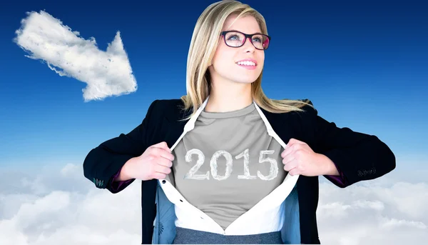 Businesswoman opening shirt in superhero — Stock Photo, Image