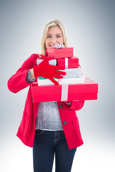 Blonde holding many gifts — Stock Photo, Image