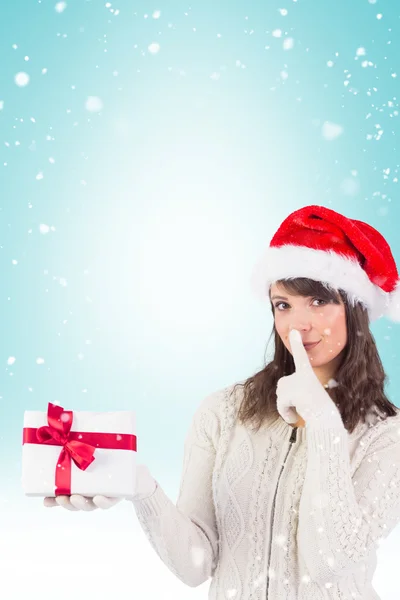 Festive brunette keeping secret — Stock Photo, Image