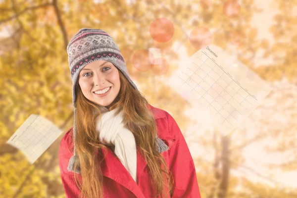 Composite image of pretty redhead in warm clothing — Stock Photo, Image